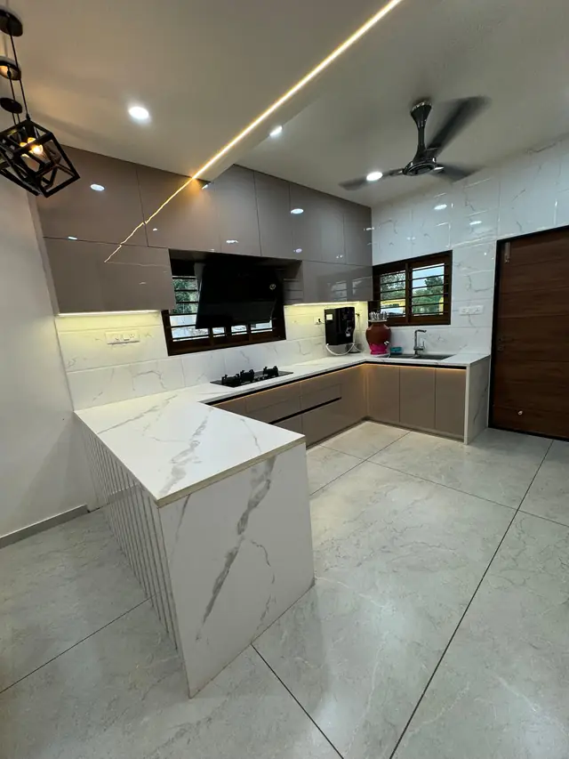 Luxury island kitchen with white marble-look countertop