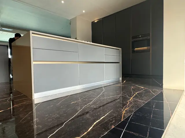Luxury kitchen elevation with panelled shutters and marble flooring