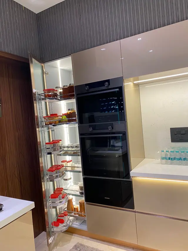 Pull-out pantry basket beside built-in appliance column