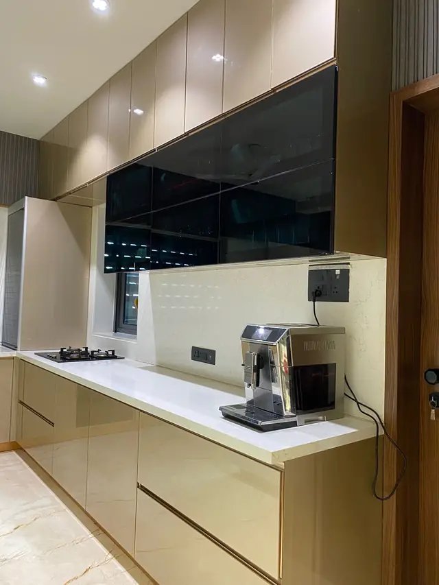Beige gloss kitchen elevation with wall mounted television