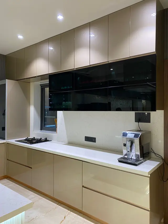 Beige modular kitchen with island and coffee machine