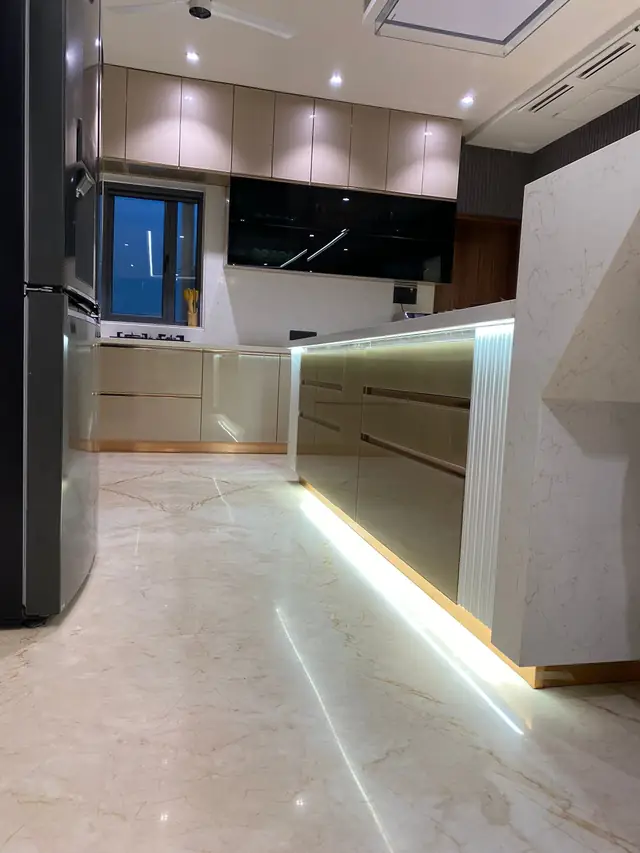 Luxury kitchen with backlit skirting and tall storage