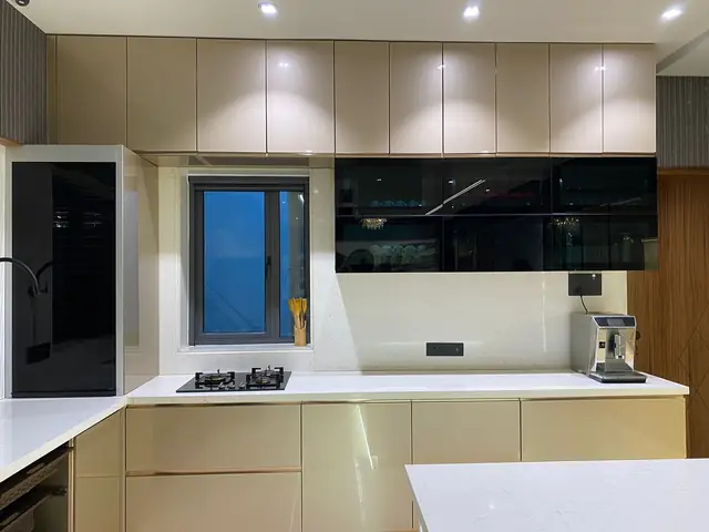White and black modular kitchen with tall unit and hob