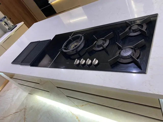 Gas hob installed on a stone island worktop