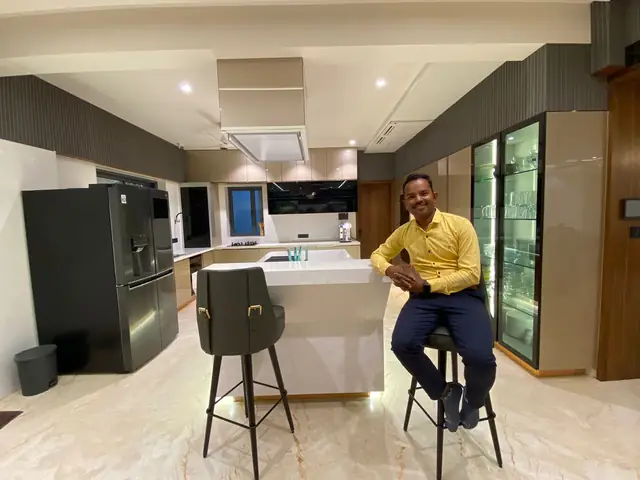 Island kitchen handover with breakfast counter seating