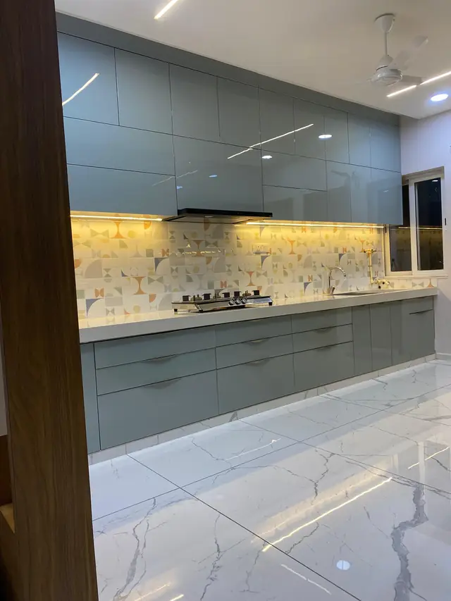 Grey parallel modular kitchen with backsplash lighting